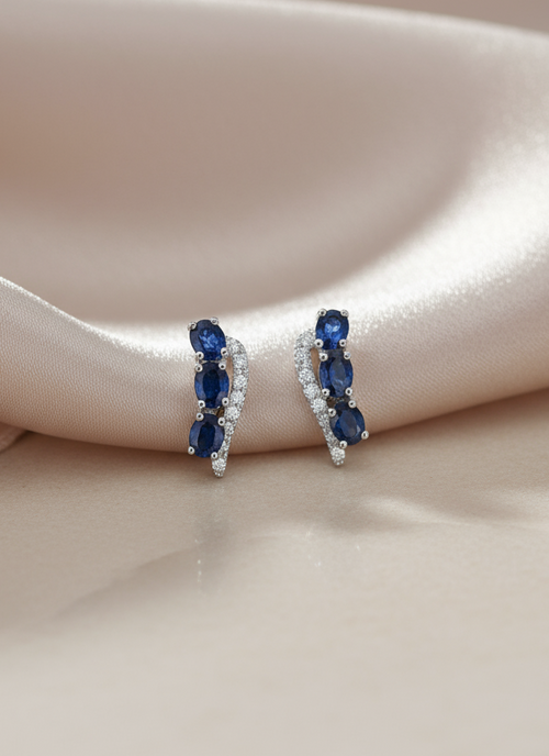 Blue Sapphire & Diamond Curved Hoop Earrings in 14K White Gold – Elegant Fine Jewelry